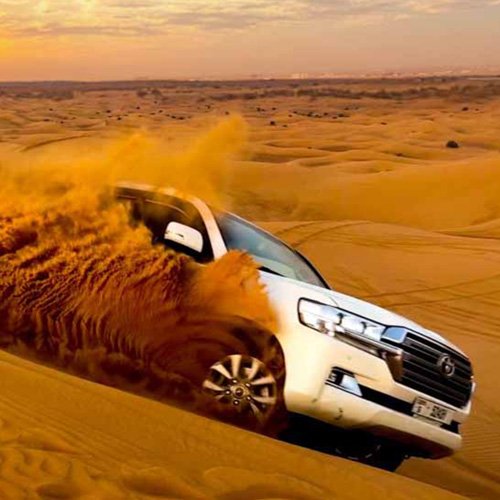 Desert safari dunes near Dubai at sunset